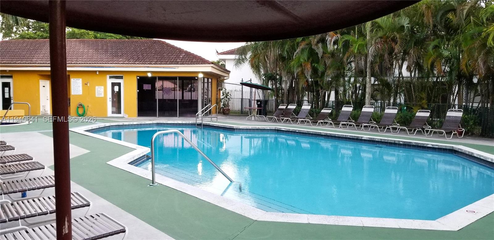 9723 Southwest 138th Avenue, Unit IA2L Miami, FL 33186 - Photo 24 of 27 a view of a swimming pool with a patio