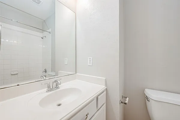a bathroom with a sink and a toilet