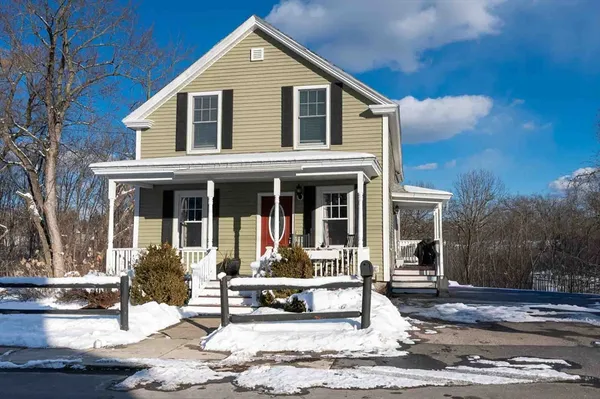 a front view of a house with a porch