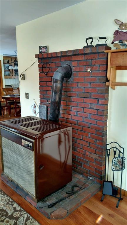 441 Augusta Road Washington, ME 04574 - Photo 11 of 28 wood stove off kitchen