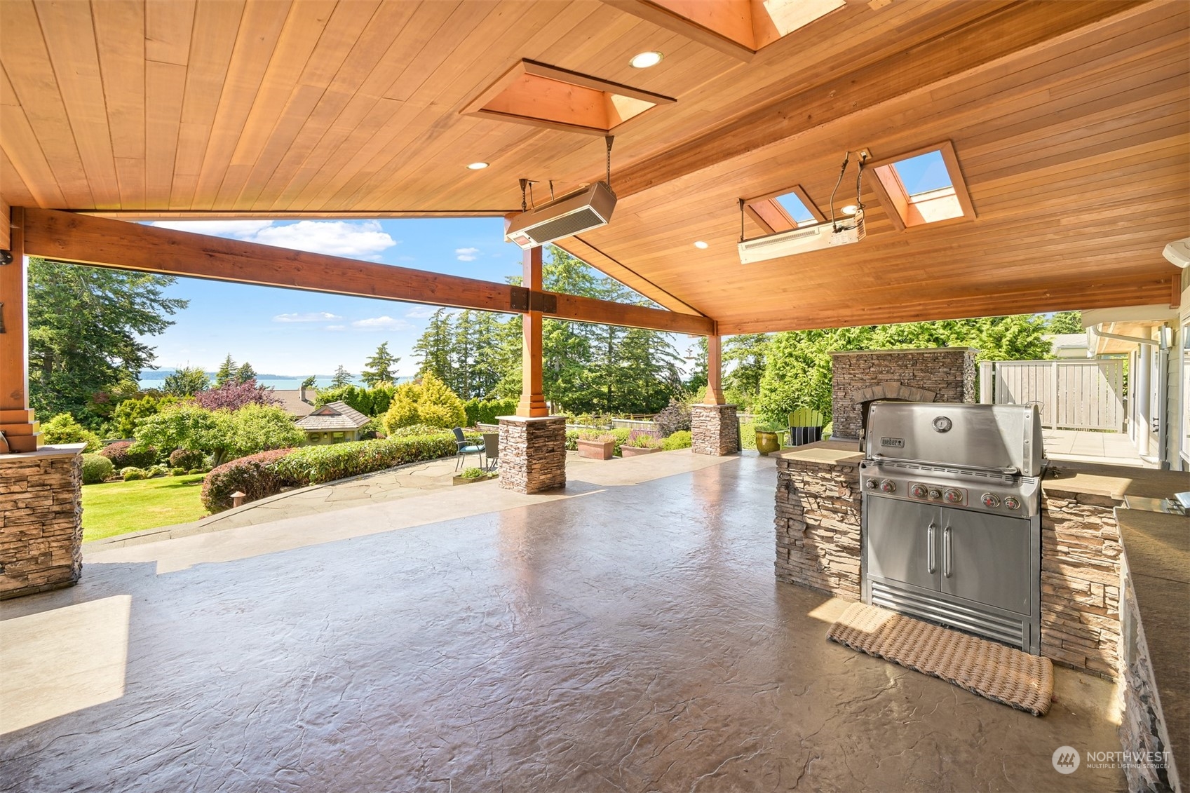516 Briar Road Bellingham, WA 98225 - Photo 14 of 39 a view of a patio with a table and chairs under an umbrella