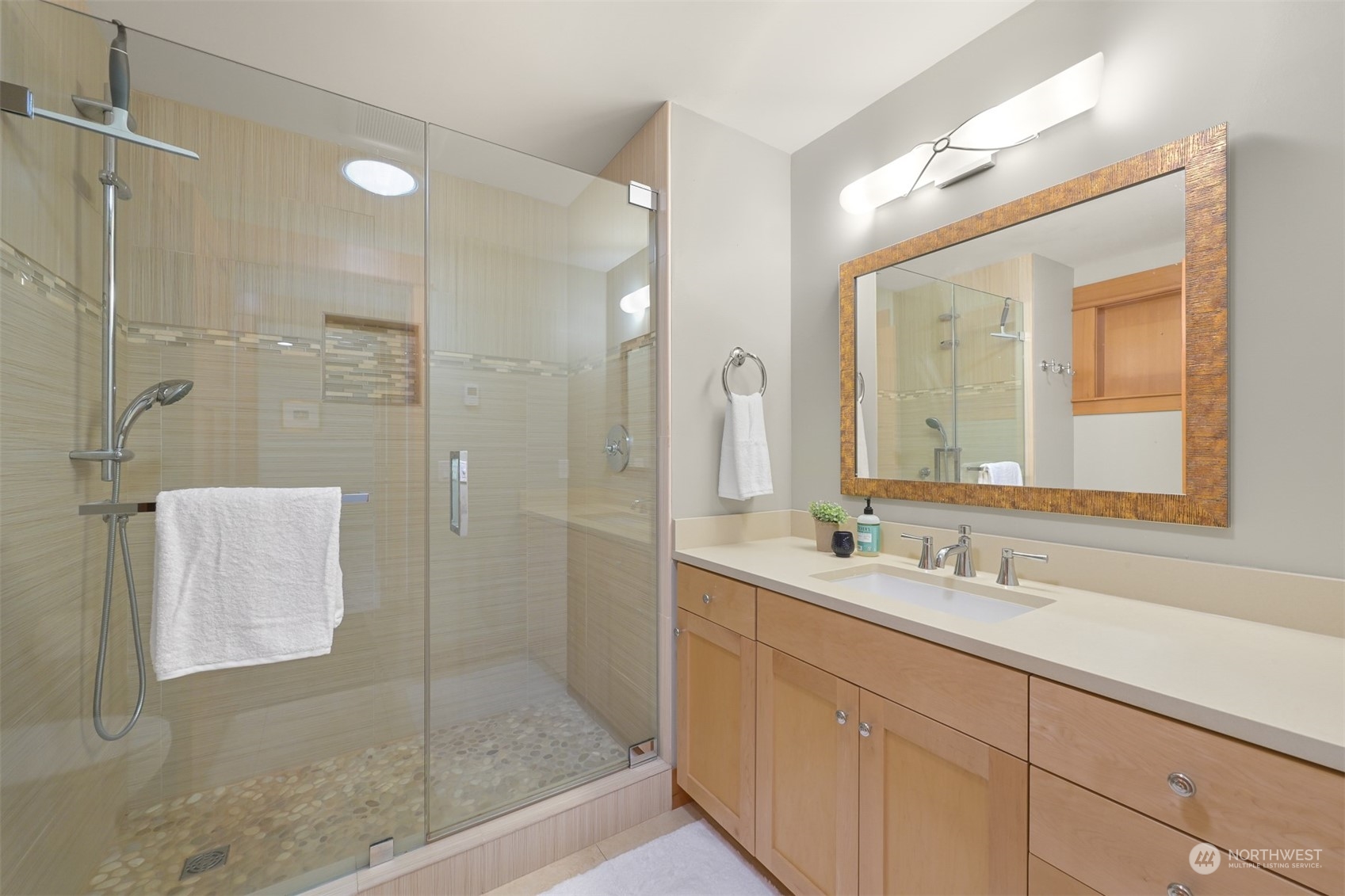 516 Briar Road Bellingham, WA 98225 - Photo 21 of 39 a bathroom with a double vanity sink mirror and shower