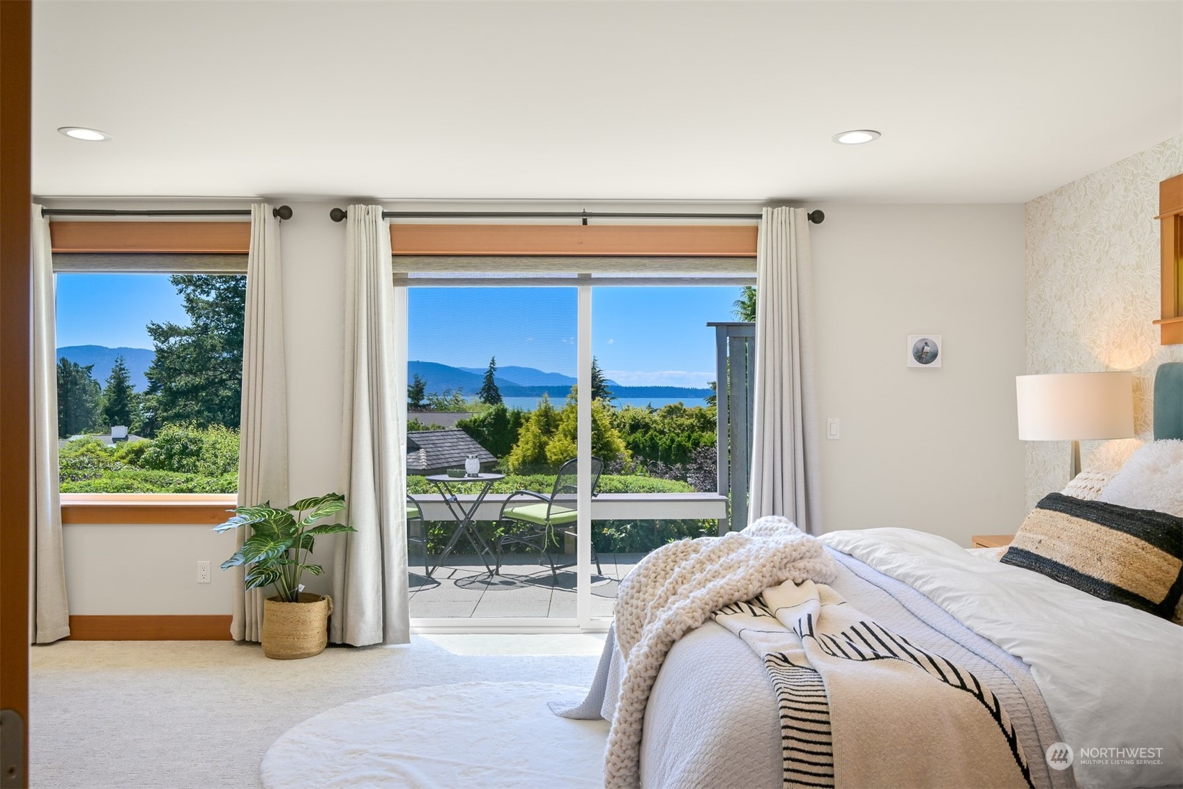 516 Briar Road Bellingham, WA 98225 - Photo 27 of 39 a bedroom with a bed and potted plant