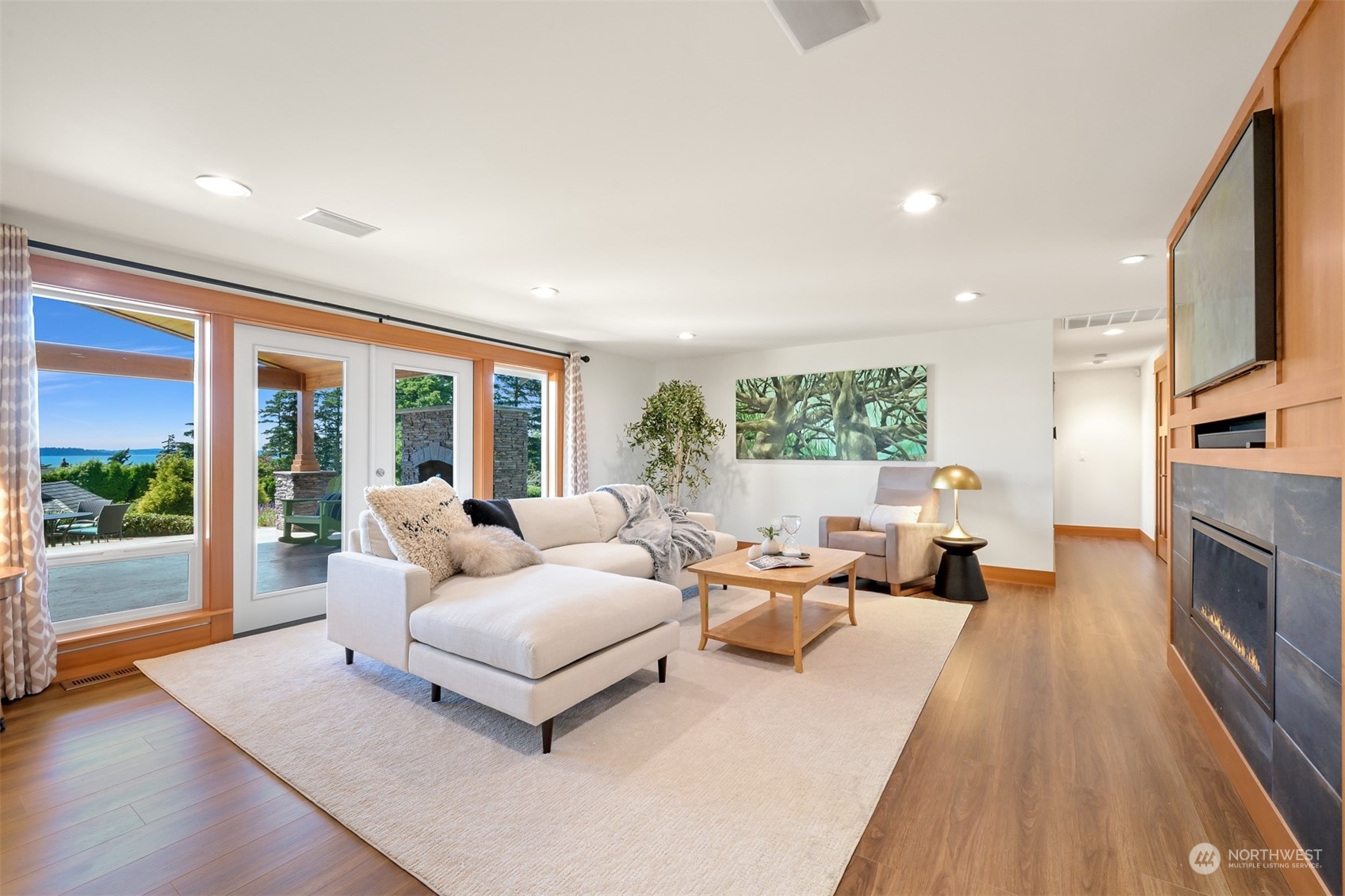 516 Briar Road Bellingham, WA 98225 - Photo 31 of 39 a living room with furniture large wooden floor and a fireplace