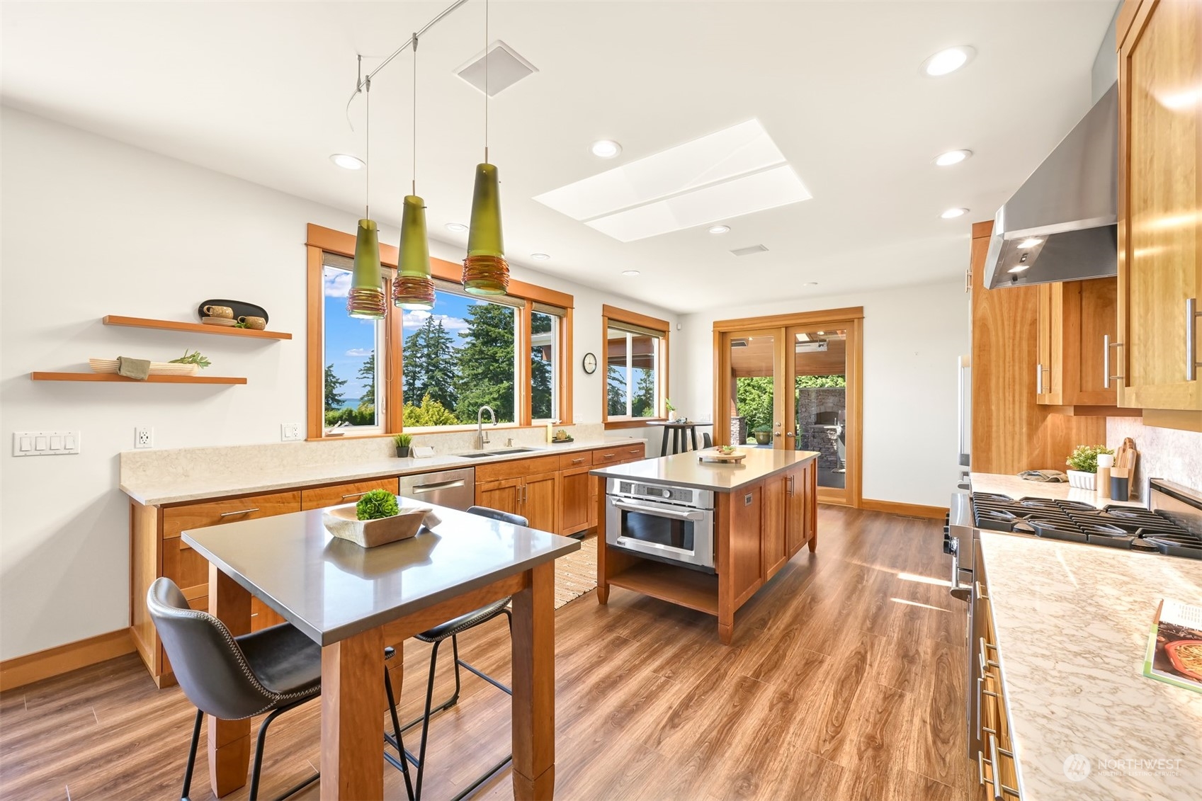516 Briar Road Bellingham, WA 98225 - Photo 10 of 39 a kitchen with a table chairs stove and kitchen island