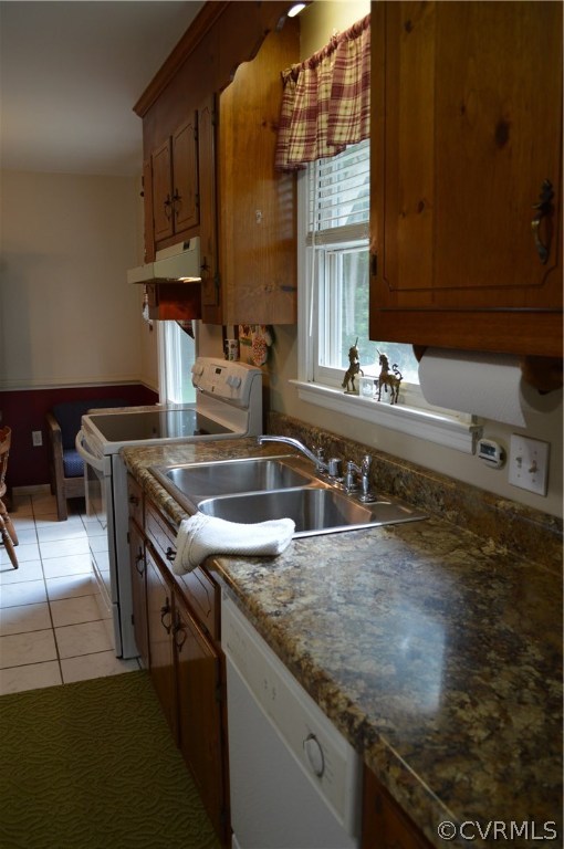 7308 Trinity Church Road Church Road, VA 23833 - Photo 11 of 37 a kitchen with kitchen island granite countertop a sink a stove and a wooden cabinets