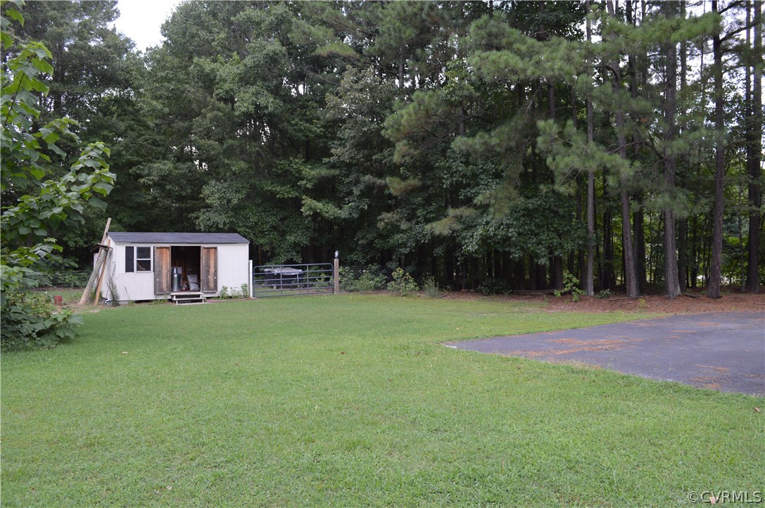 7308 Trinity Church Road Church Road, VA 23833 - Photo 24 of 37 a view of a backyard with a garden