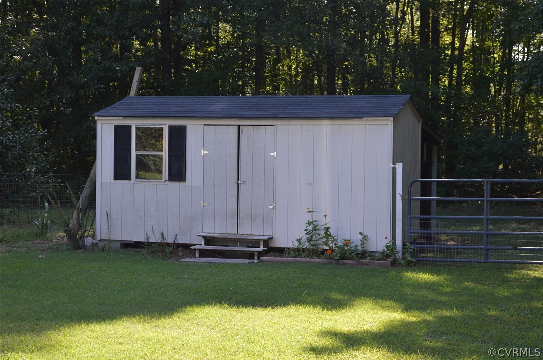 7308 Trinity Church Road Church Road, VA 23833 - Photo 26 of 37 a view of a backyard with potted plants and large tree