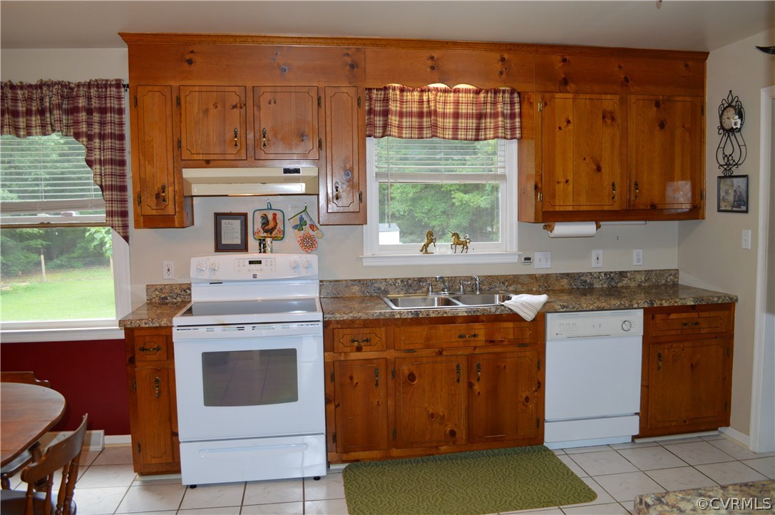 7308 Trinity Church Road Church Road, VA 23833 - Photo 5 of 37 a kitchen with stainless steel appliances granite countertop a stove a sink and a microwave