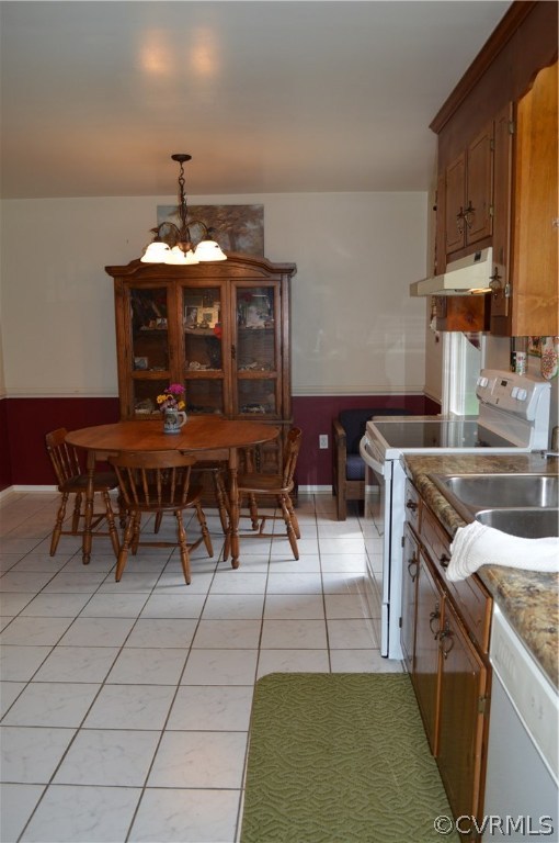 7308 Trinity Church Road Church Road, VA 23833 - Photo 9 of 37 a kitchen with a sink a counter and chairs