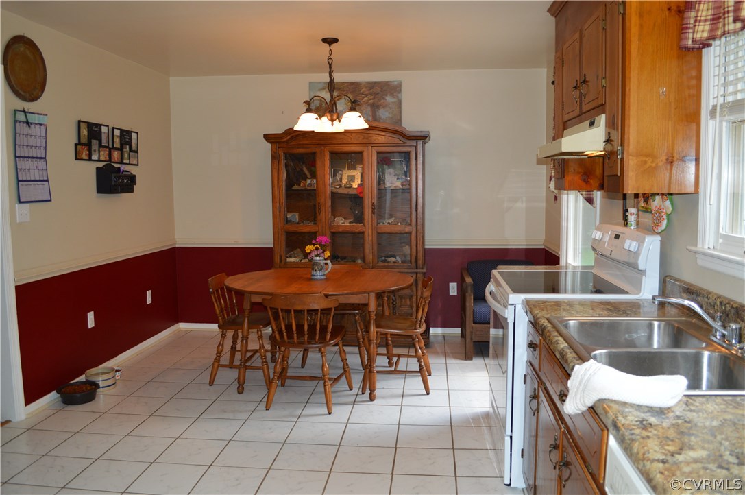 7308 Trinity Church Road Church Road, VA 23833 - Photo 10 of 37 a view of a dining room with furniture and chandelier