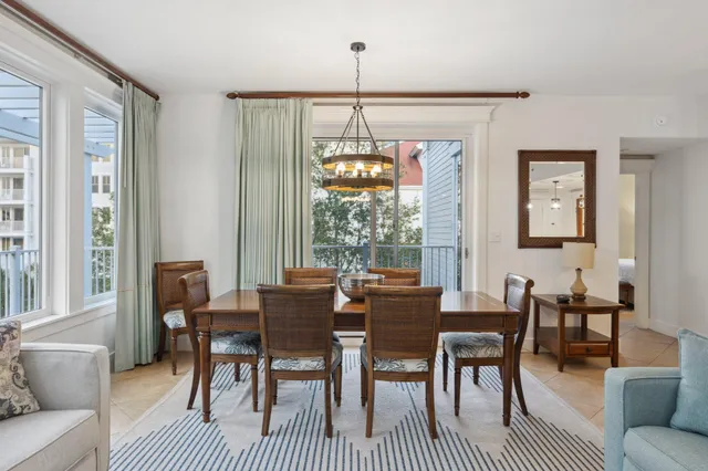 a kitchen with stainless steel appliances a sink a refrigerator a stove and a wooden floor