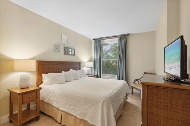 a bathroom with a sink mirror and a shower