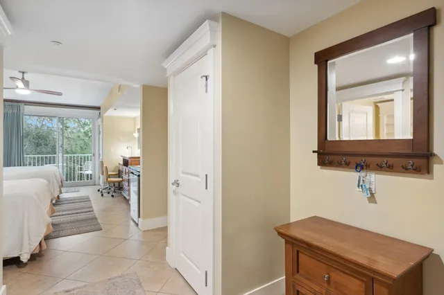 a kitchen with a stove a sink a dining table and chairs