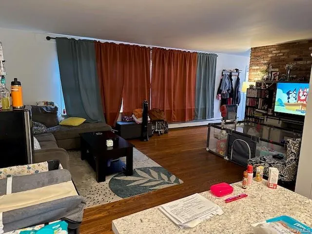 a room with furniture and a flat screen tv