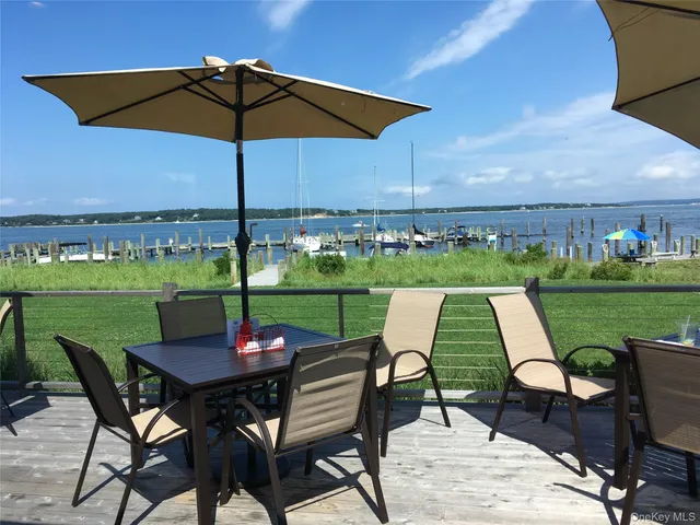 a view of a patio with furniture and yard