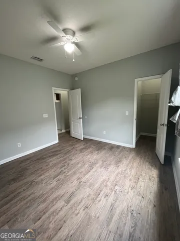 a view of an empty room and wooden floor