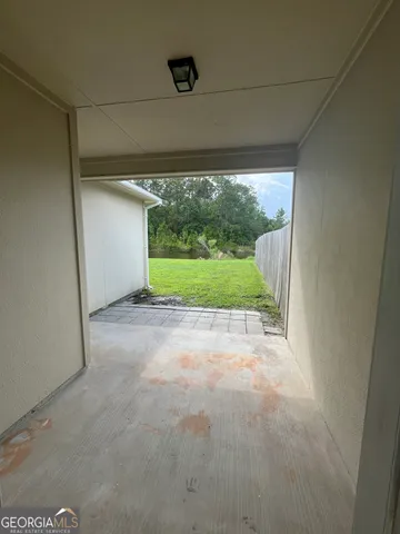 a view of a green room with a large window