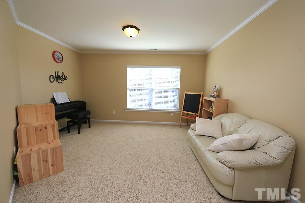800 Roni Court Cary, NC 27519 - Photo 13 of 25 a living room with furniture and a window
