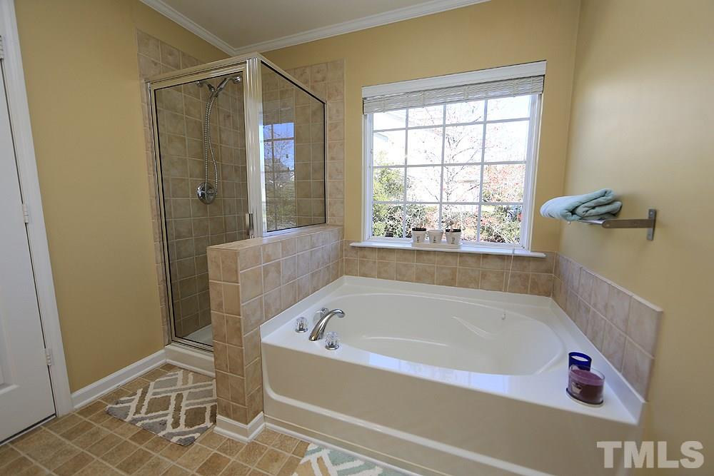 800 Roni Court Cary, NC 27519 - Photo 15 of 25 a white bath tub sitting next to a window