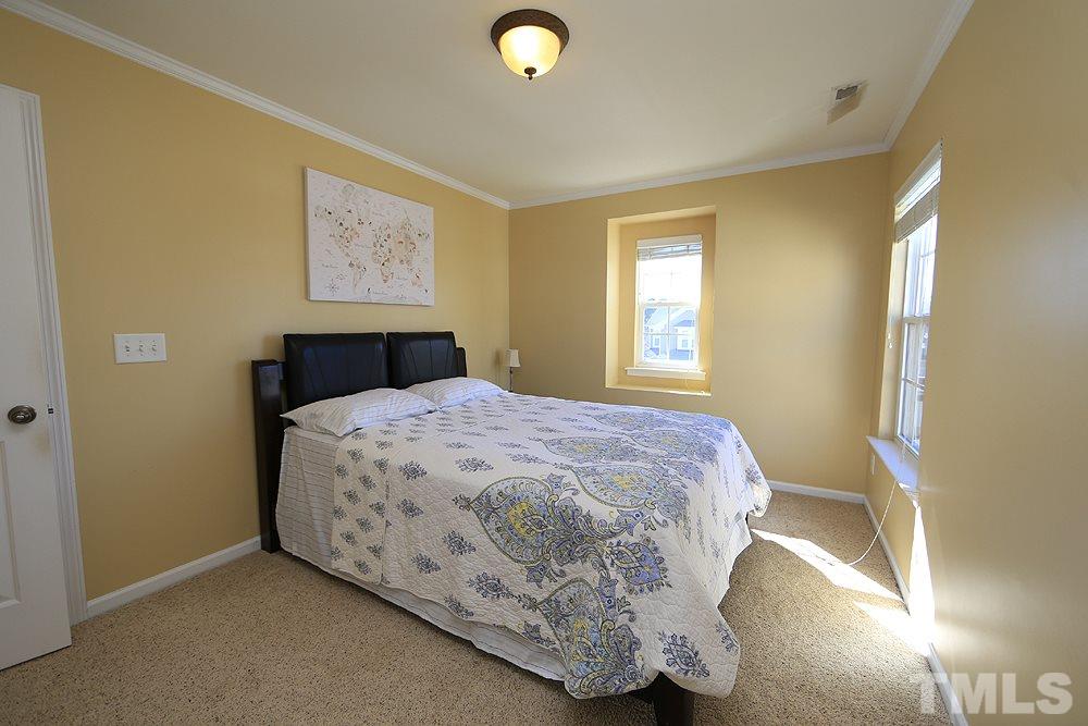 800 Roni Court Cary, NC 27519 - Photo 17 of 25 a bedroom with a bed and a window