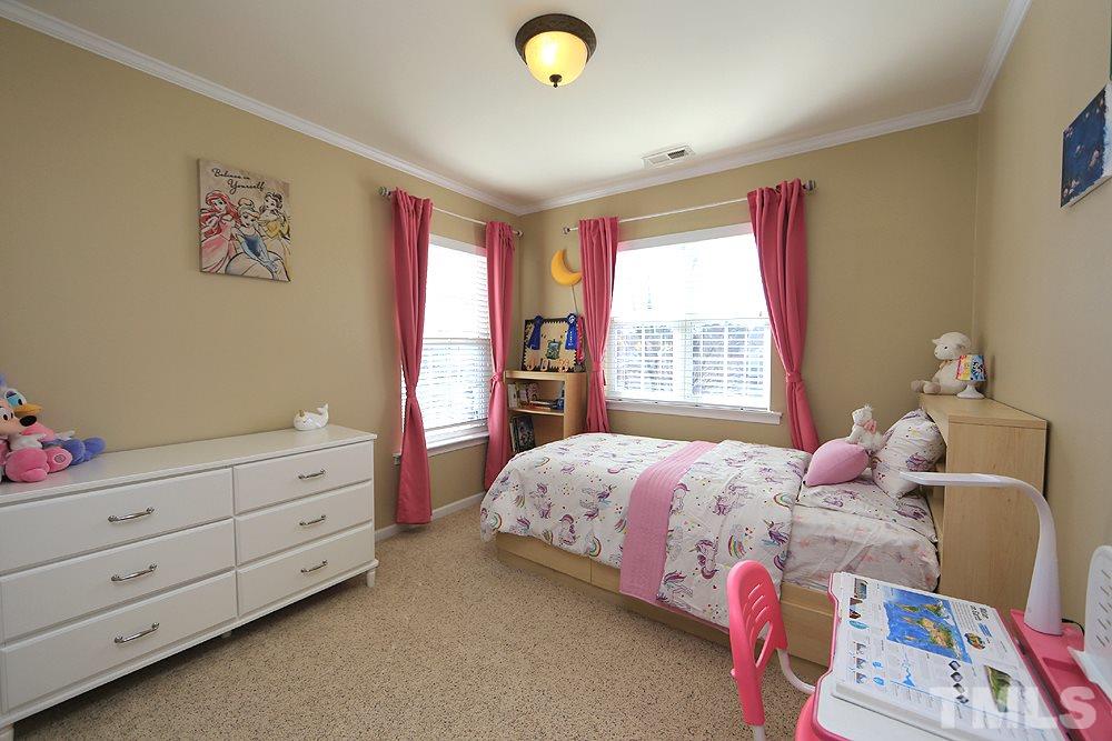 800 Roni Court Cary, NC 27519 - Photo 18 of 25 a bedroom with a bed and a window