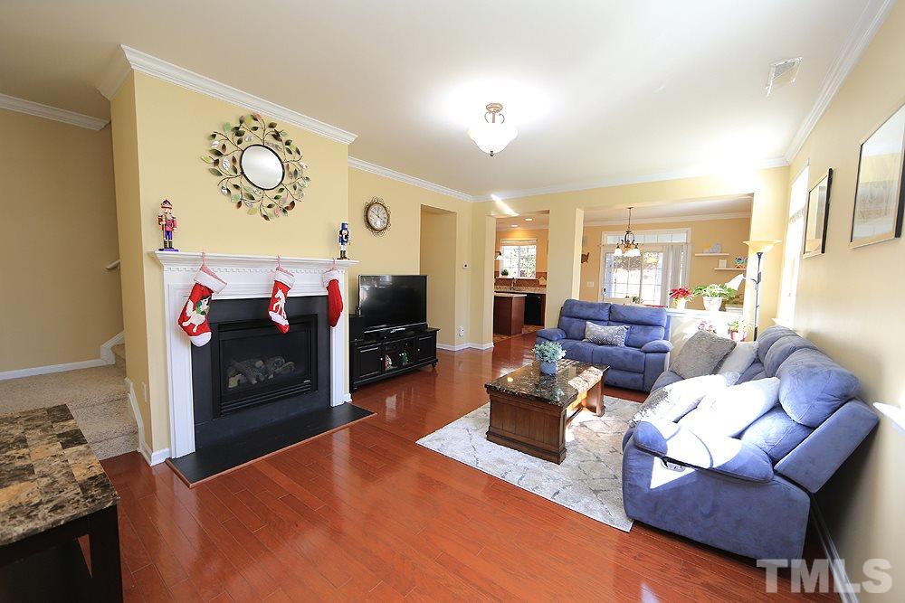 800 Roni Court Cary, NC 27519 - Photo 4 of 25 a living room with furniture and a flat screen tv