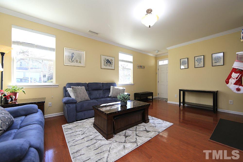 800 Roni Court Cary, NC 27519 - Photo 5 of 25 a living room with furniture a rug and a window