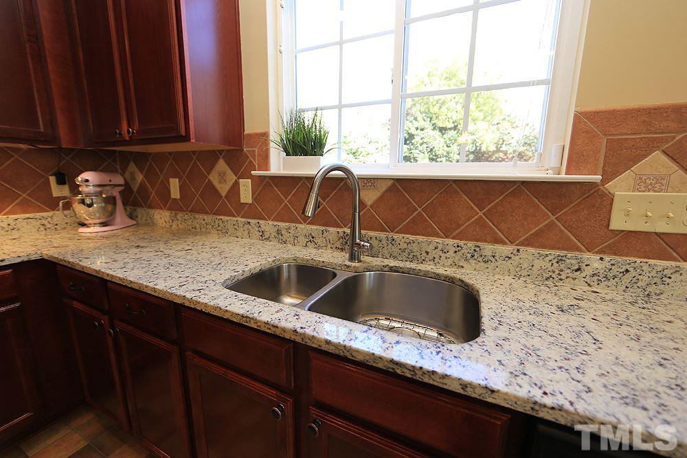 800 Roni Court Cary, NC 27519 - Photo 10 of 25 a kitchen with a sink and a window
