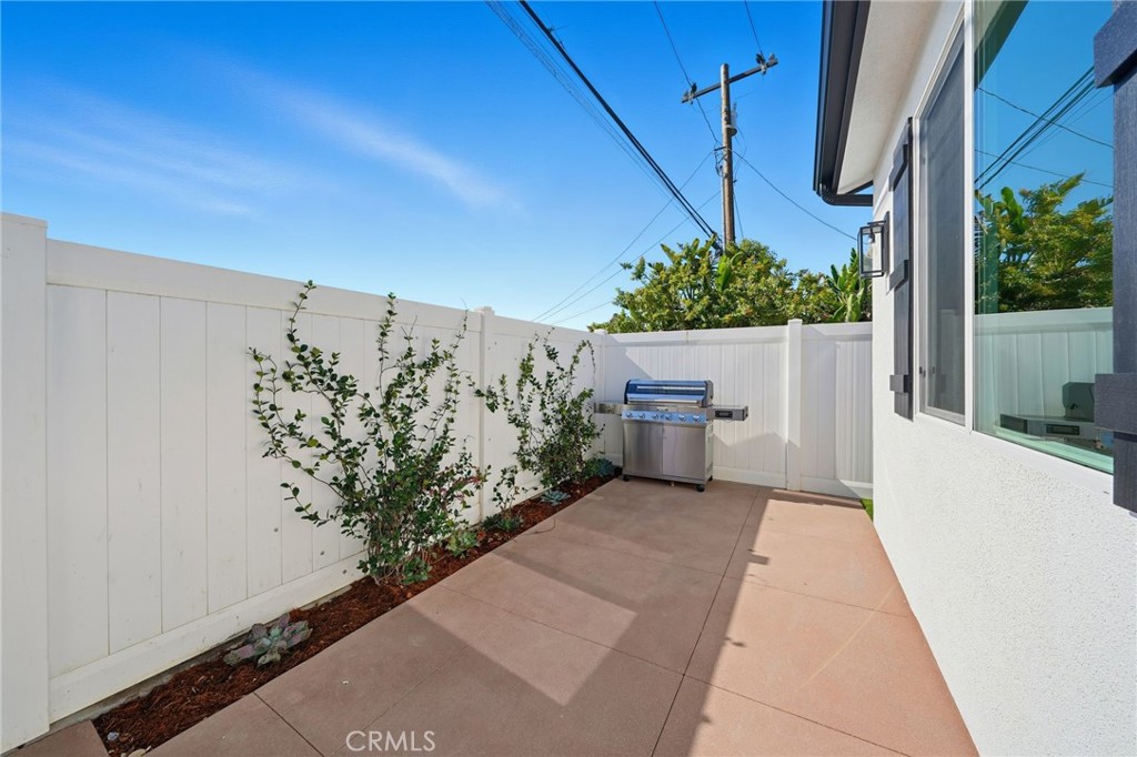 317 Rochester Street, Unit B Costa Mesa, CA 92627 - Photo 12 of 12 a view of a pathway with a building in the background