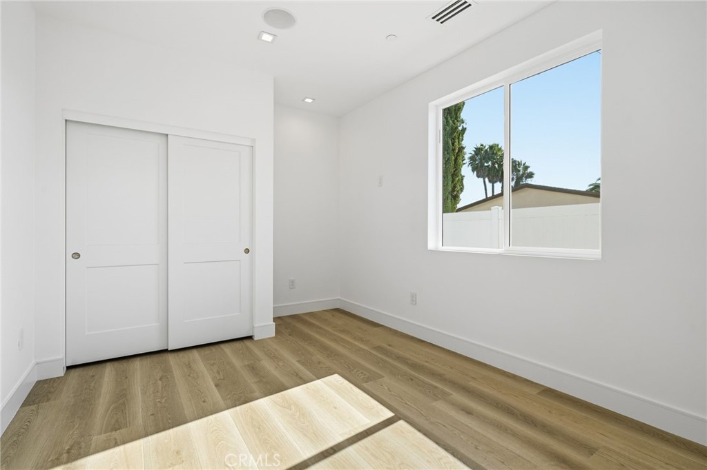 317 Rochester Street, Unit B Costa Mesa, CA 92627 - Photo 8 of 12 a view of an empty room with a window