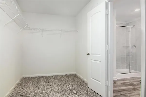 a bathroom with a glass shower door