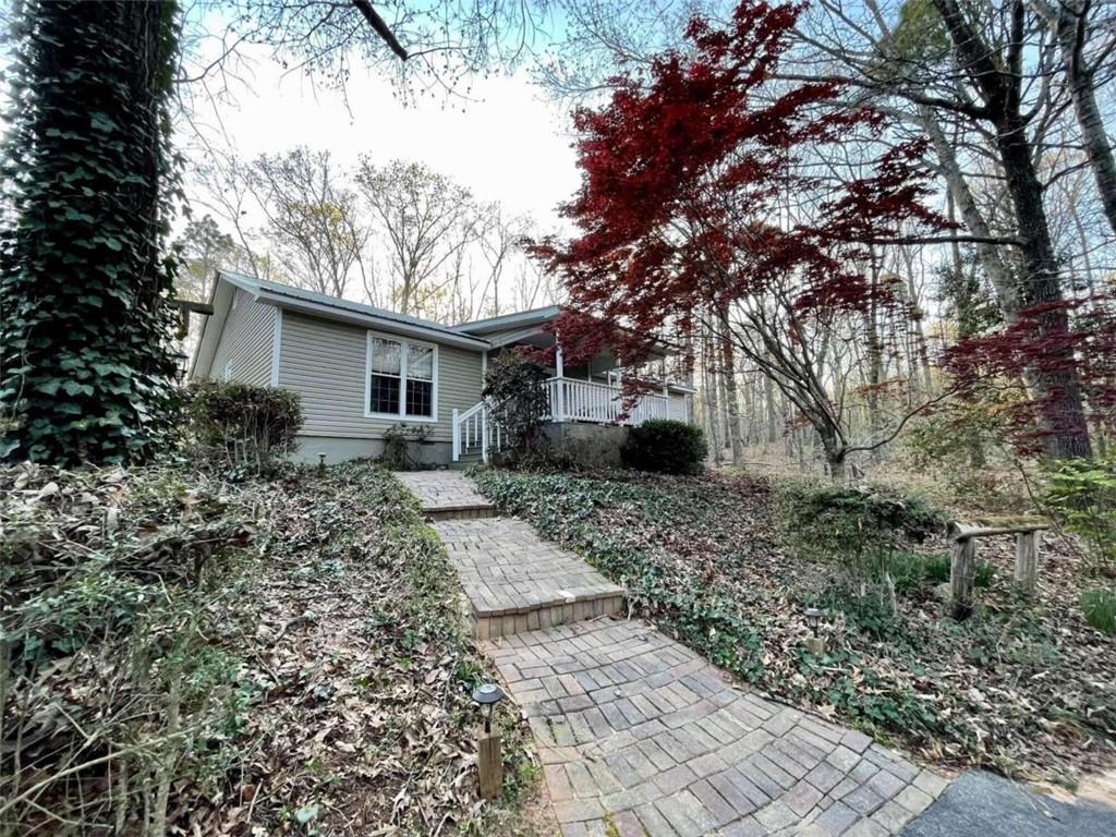 7201 Shell Road Winston, GA 30187 - Photo 1 of 1 a backyard of a house with barbeque oven table and chairs