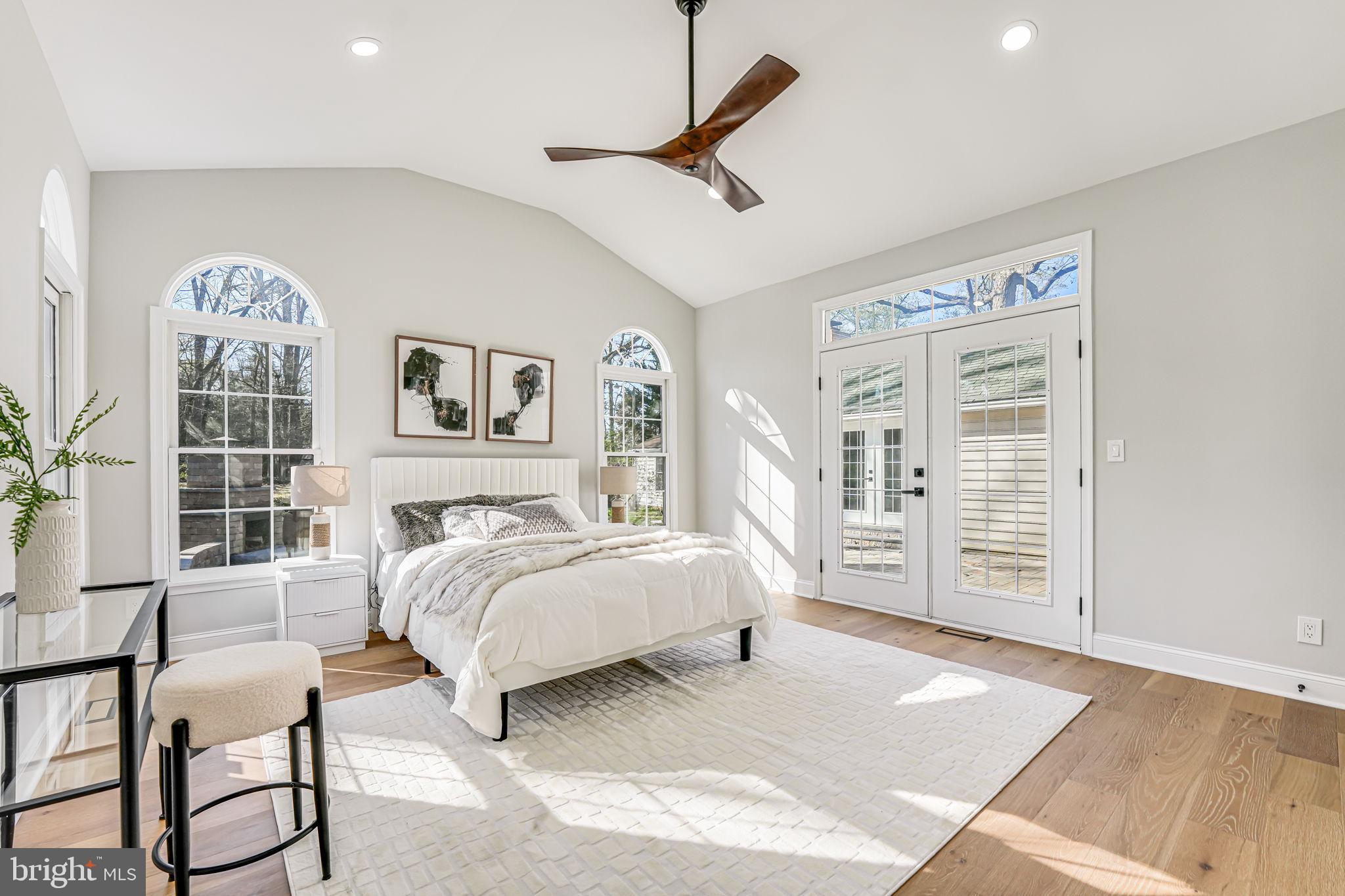 3620 Hill Street Fairfax, VA 22030 - Photo 27 of 71 a bedroom with a large bed a chandelier and a window