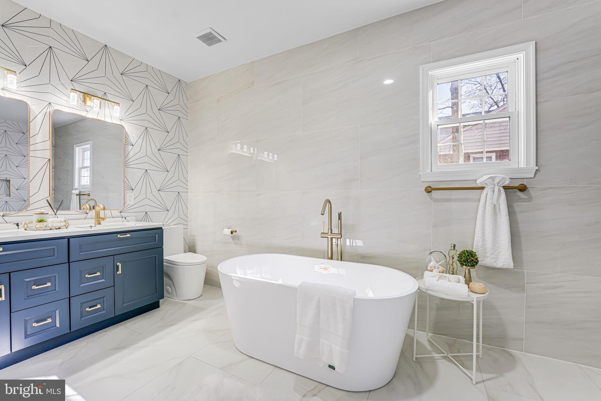 3620 Hill Street Fairfax, VA 22030 - Photo 28 of 71 a bathroom with a tub sink and mirror