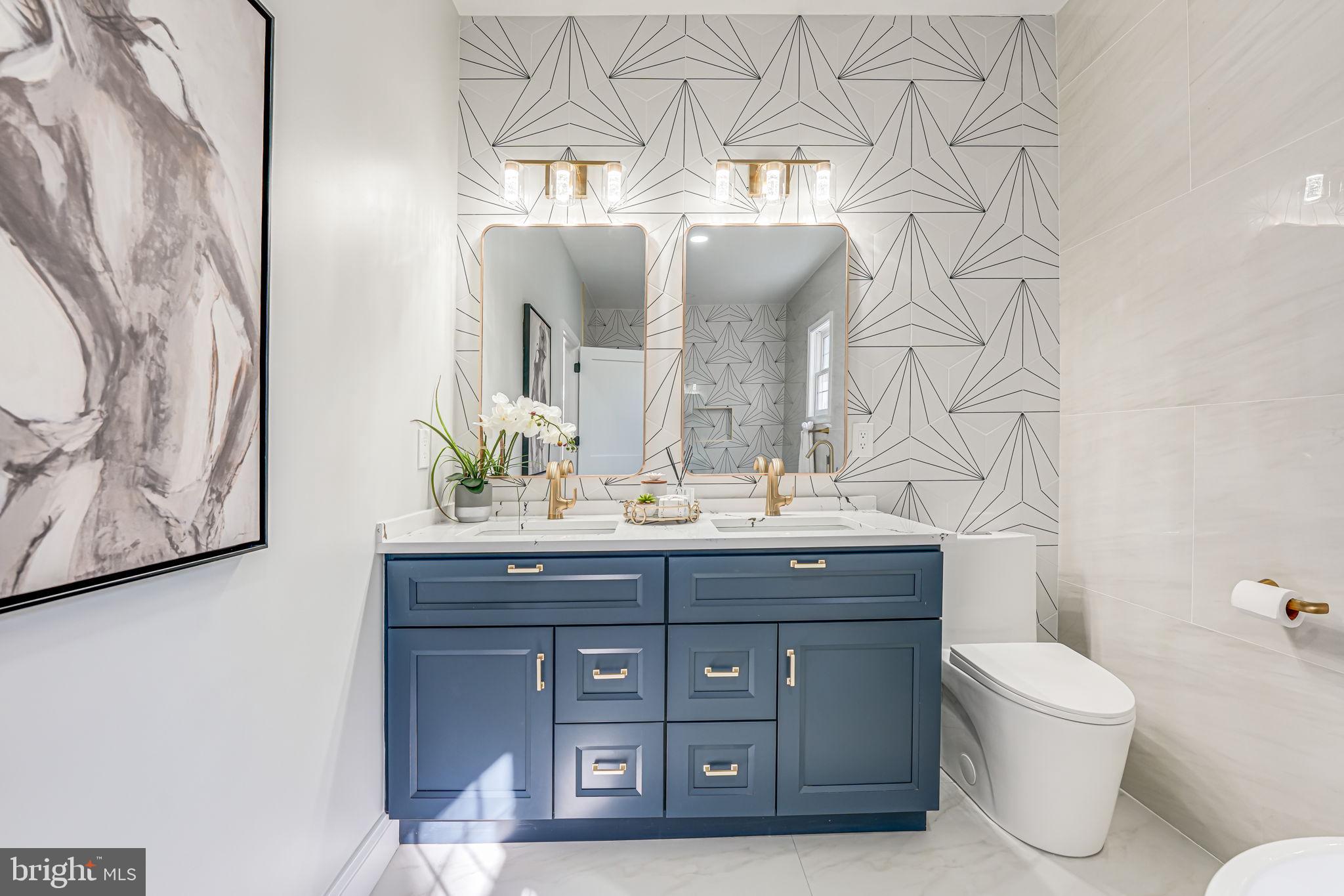 3620 Hill Street Fairfax, VA 22030 - Photo 29 of 71 a bathroom with a granite countertop sink a toilet and with mirror
