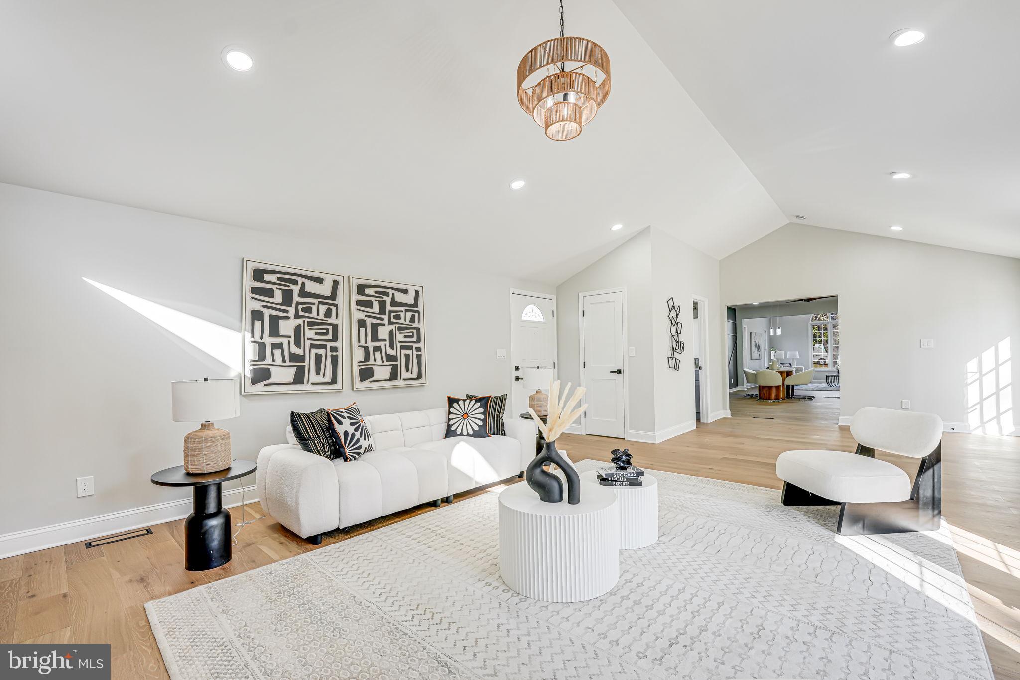 3620 Hill Street Fairfax, VA 22030 - Photo 33 of 71 a living room with furniture a rug and a chandelier