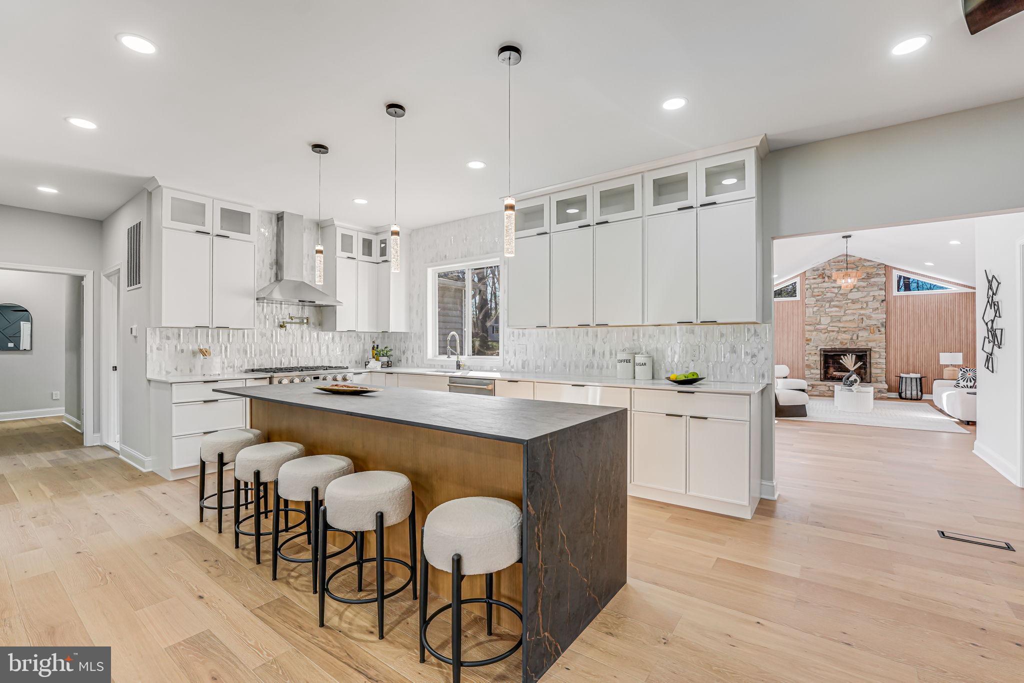 3620 Hill Street Fairfax, VA 22030 - Photo 4 of 71 a large kitchen with kitchen island a sink white cabinets and stainless steel appliances