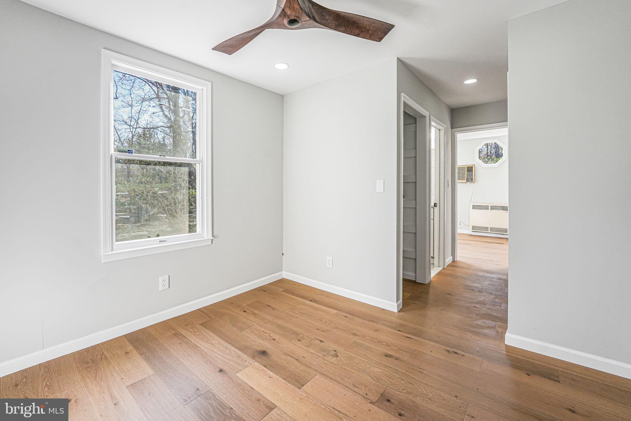 3620 Hill Street Fairfax, VA 22030 - Photo 63 of 71 an empty room with wooden floor and windows