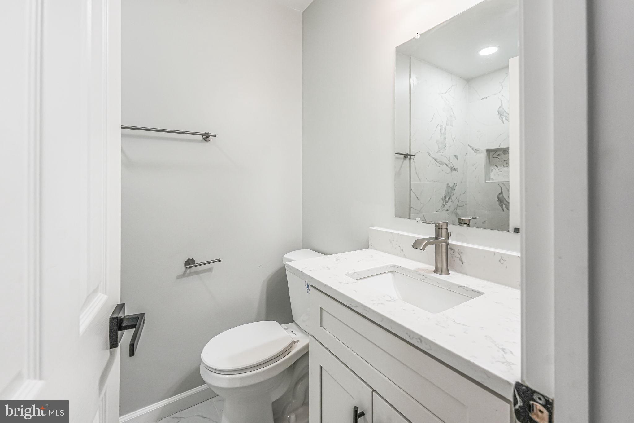 3620 Hill Street Fairfax, VA 22030 - Photo 66 of 71 a bathroom with a sink toilet and a mirror