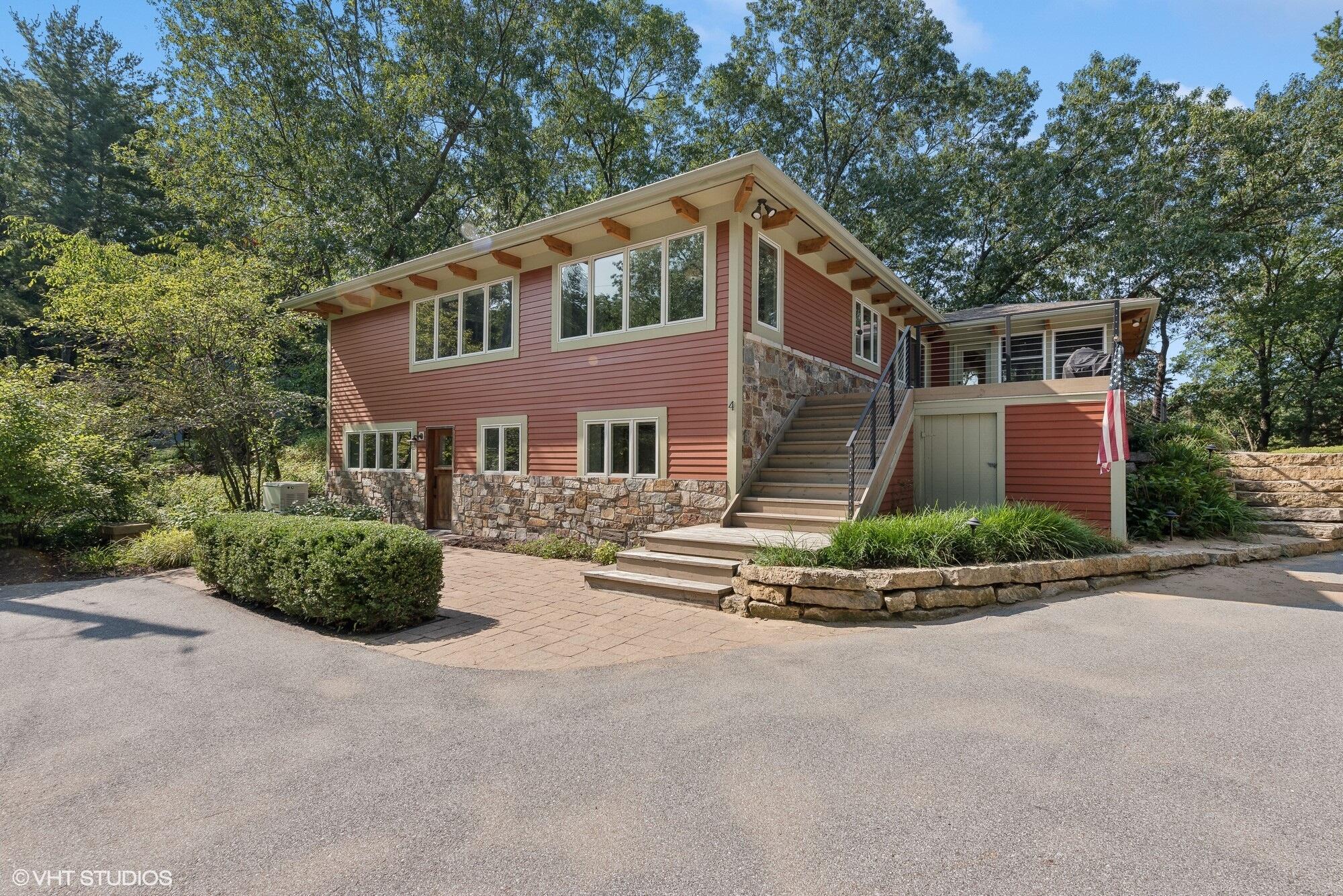 4 Circle Drive Dune Acres, IN 46304 - Photo 1 of 31 a front view of a house with a garden