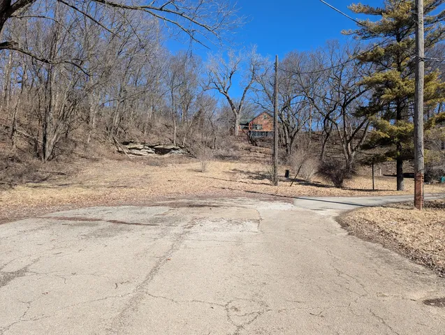a view of snow on the side of the road