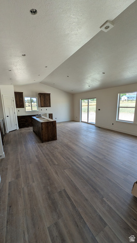26063 North 8800th West Portage, UT 84331 - Photo 2 of 9 Spacious room featuring wood-finish flooring, vaulted ceilings, and recessed lighting