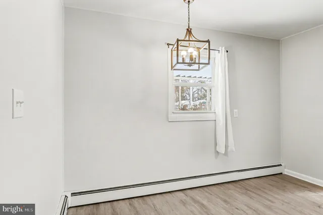 a view of a hallway with a window