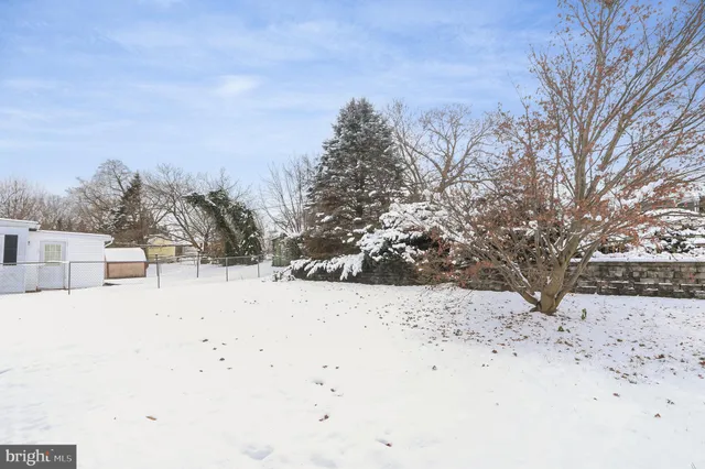 a view of snow covered with snow in front of house