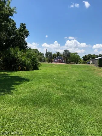 a view of a green field with sky view