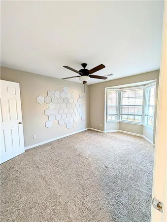 a kitchen with granite countertop a stove and a refrigerator