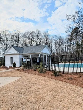 a view of a house with a backyard