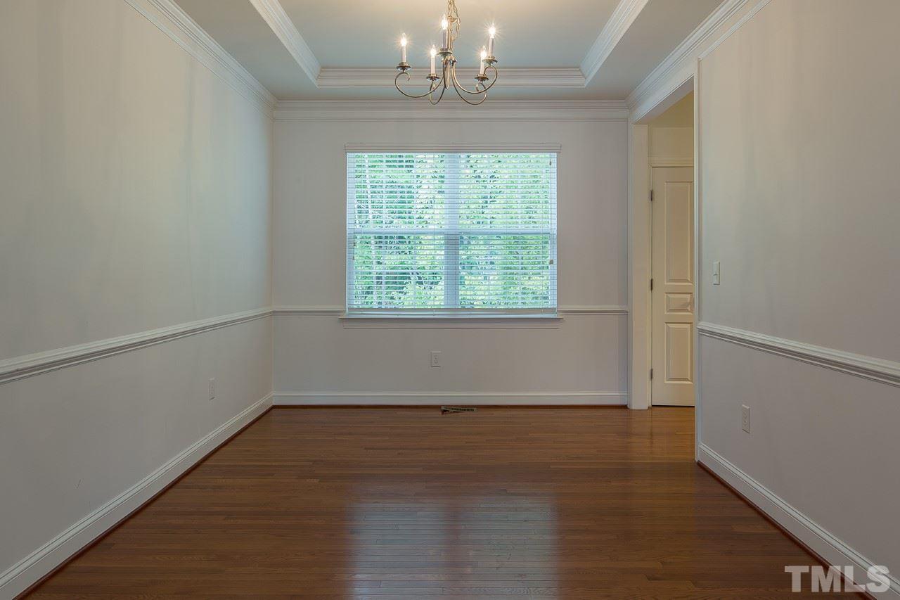 707 Turmeric Lane Durham, NC 27713 - Photo 4 of 18 an empty room with wooden floor and windows