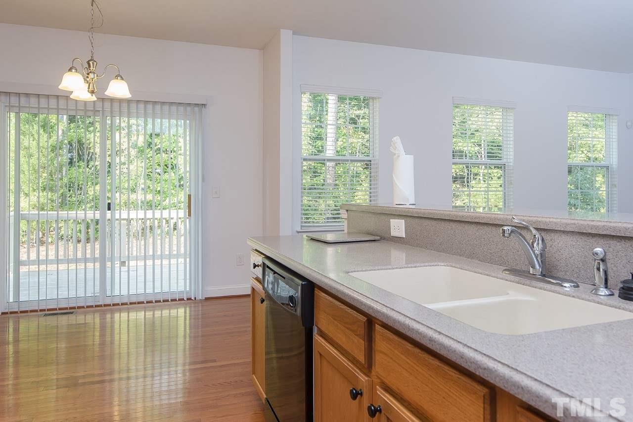 707 Turmeric Lane Durham, NC 27713 - Photo 6 of 18 a bathroom with a sink and large window